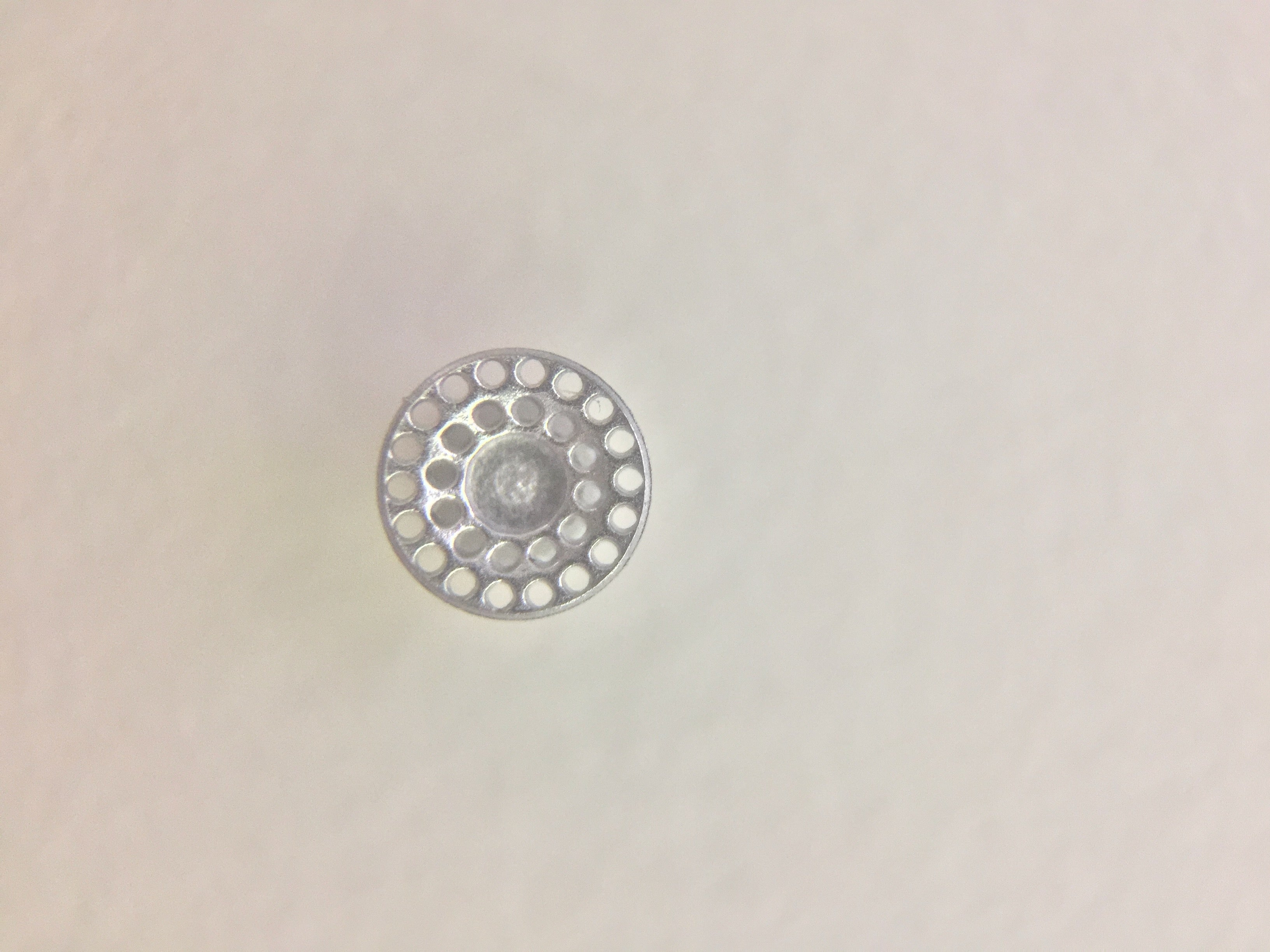 Zeronik lingual button